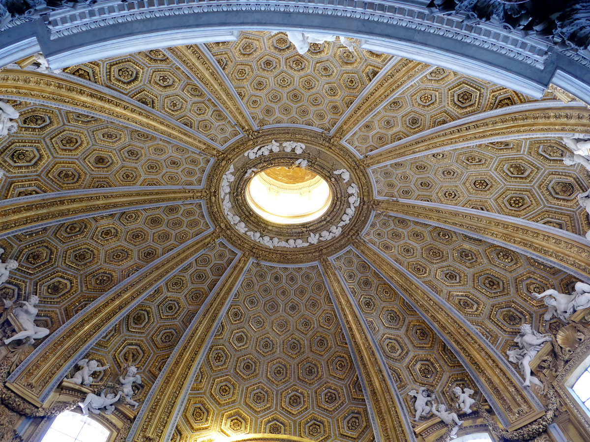 oval ceiling with hexagons, a huge amount of gold leaf, and lots of plaster cherubs